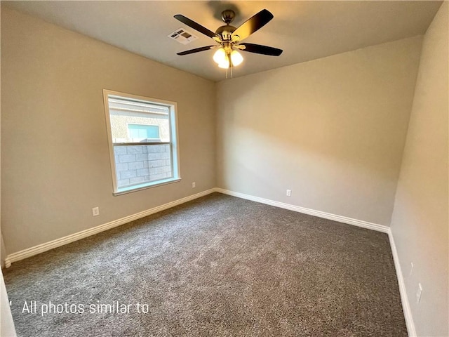 3371 N Apache St, Kingman, AZ 86401 - unfurnished room featuring dark colored carpet, baseboards, and a ceiling fan