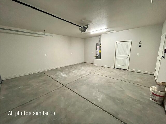 3371 N Apache St, Kingman, AZ 86401 - garage with gas water heater, baseboards, and a garage door opener