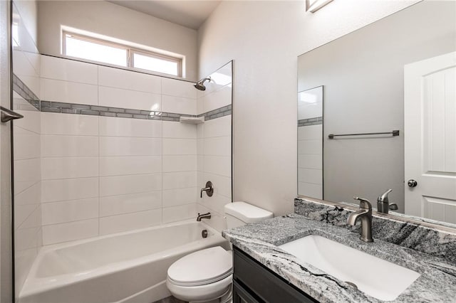 bathroom featuring toilet, bathing tub / shower combination, and vanity
