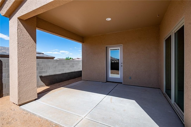 view of patio / terrace featuring fence