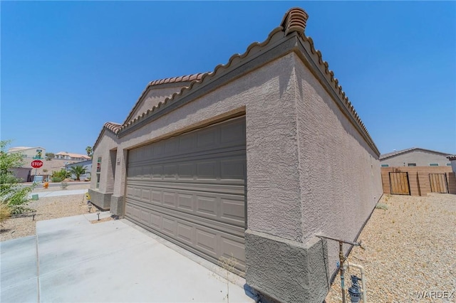 garage featuring fence