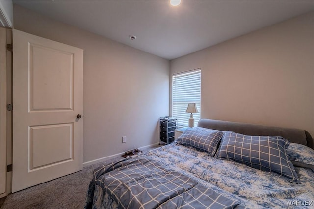 carpeted bedroom with baseboards