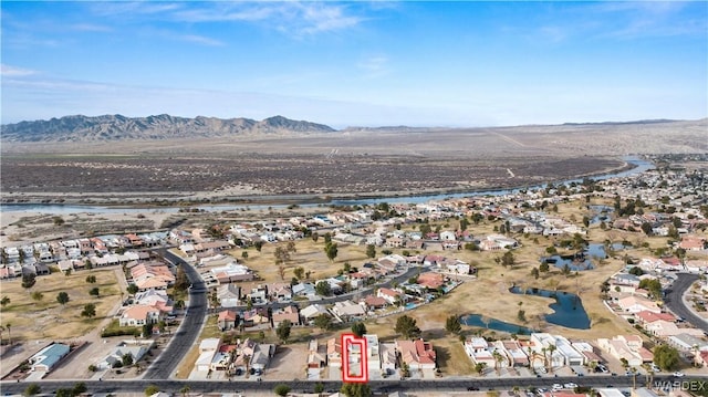 aerial view featuring a residential view and a water and mountain view