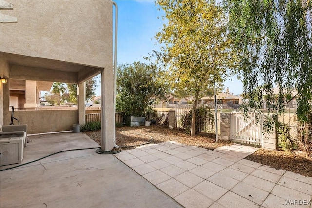 view of patio featuring fence