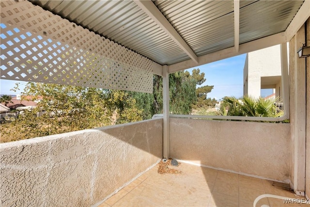 view of patio featuring a balcony