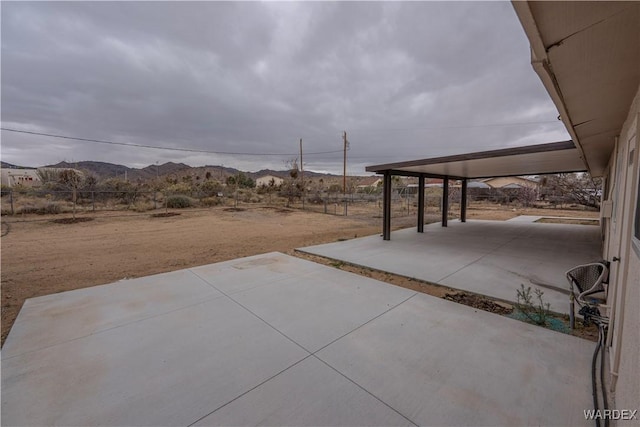 view of patio / terrace with a mountain view