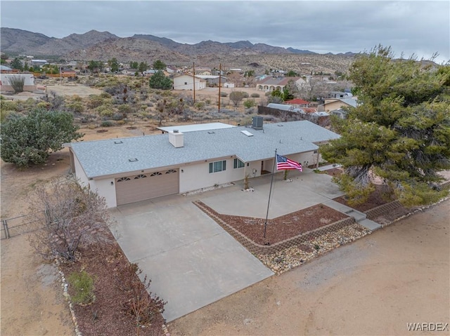 drone / aerial view featuring a mountain view