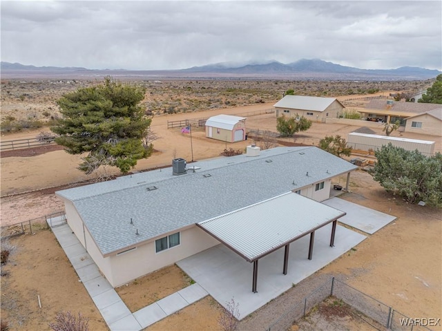 bird's eye view with a desert view and a mountain view