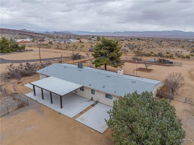 drone / aerial view with a mountain view and a desert view