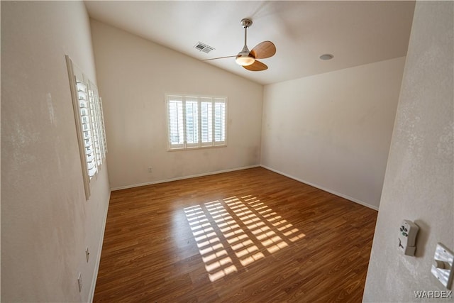 unfurnished room featuring visible vents, ceiling fan, wood finished floors, and lofted ceiling