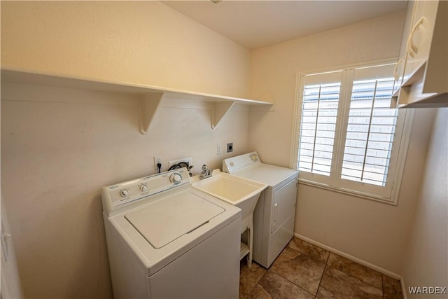 laundry room with baseboards, laundry area, and independent washer and dryer