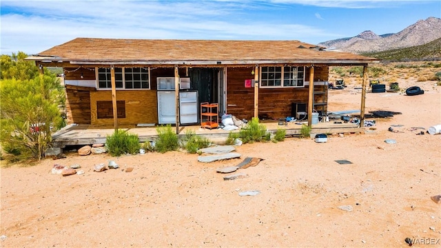 view of front facade with an outbuilding and a mountain view