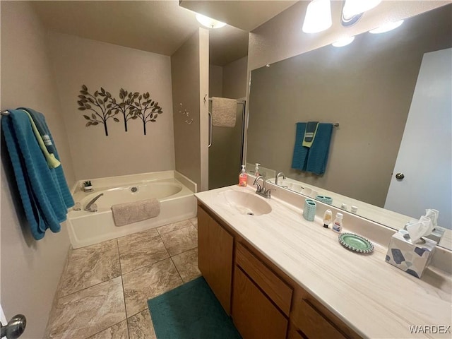 bathroom with vanity and a bath