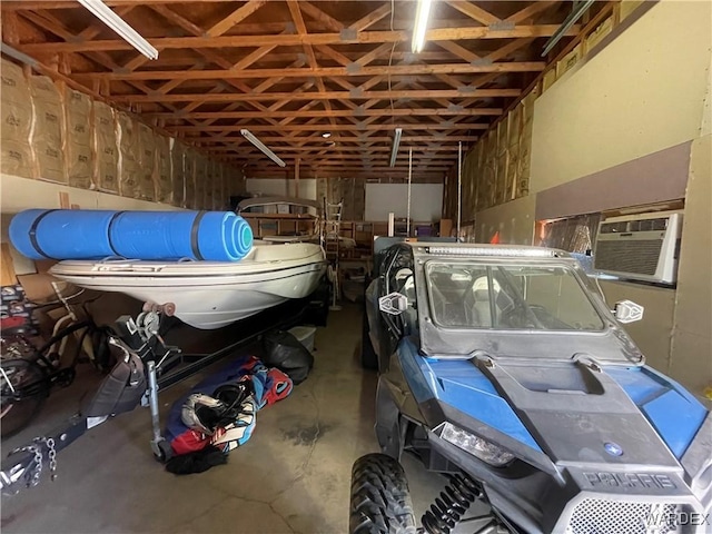 garage featuring a wall mounted air conditioner