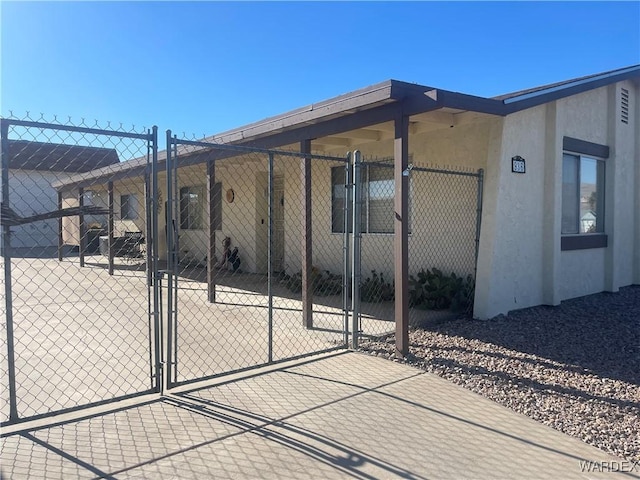 view of patio with a gate and fence