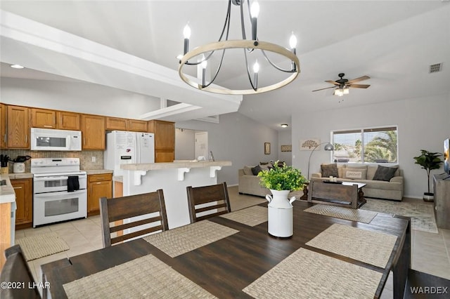 dining space with light wood-type flooring, visible vents, and ceiling fan with notable chandelier