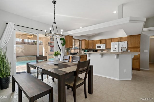 dining area featuring recessed lighting, baseboards, an inviting chandelier, and light tile patterned flooring