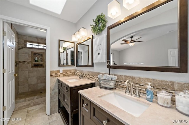full bathroom with a walk in shower, two vanities, a sink, and tile patterned flooring