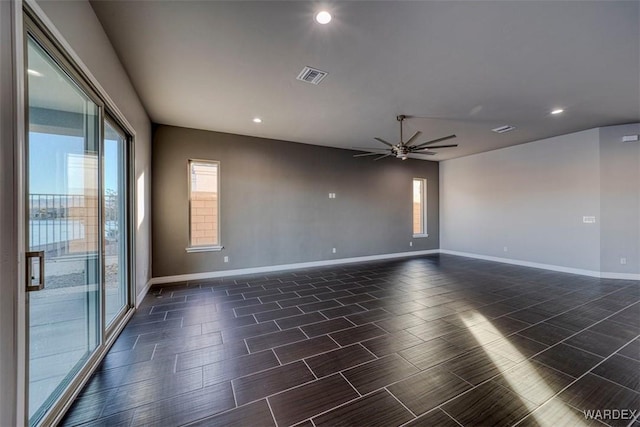 unfurnished room featuring recessed lighting, visible vents, ceiling fan, and baseboards