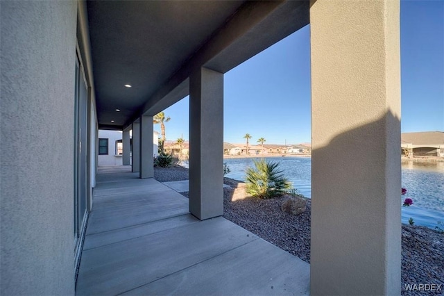 view of patio / terrace featuring a water view