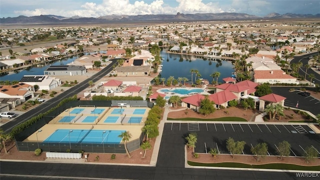 bird's eye view featuring a residential view and a water and mountain view