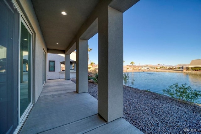 view of patio featuring a water view