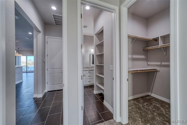 walk in closet featuring visible vents