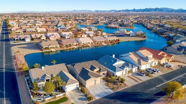 bird's eye view featuring a residential view and a water and mountain view