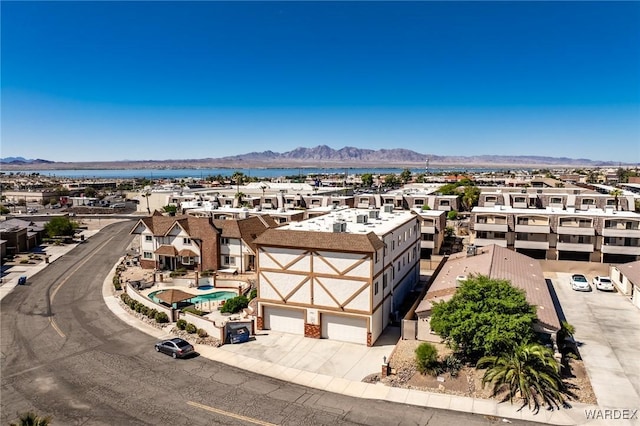 drone / aerial view with a residential view and a mountain view