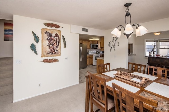 dining area with stairway, light carpet, visible vents, and baseboards