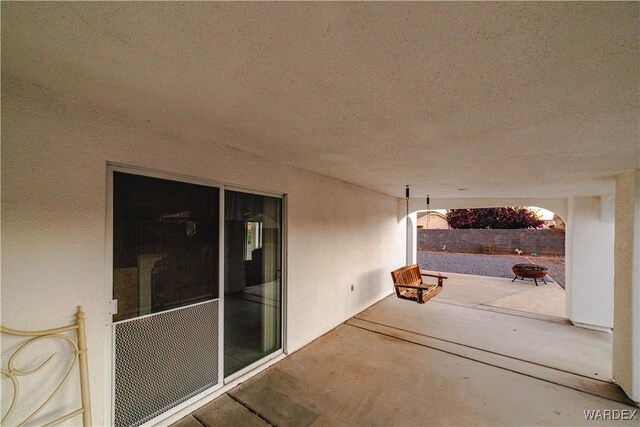 view of patio / terrace with an outdoor fire pit