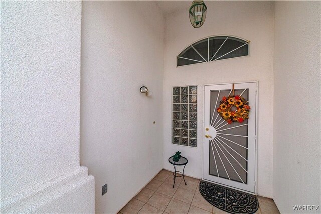 entrance to property featuring stucco siding