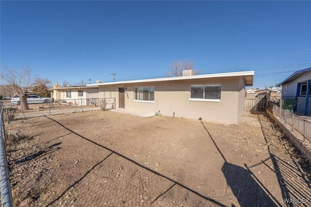 rear view of house with fence private yard and a patio area