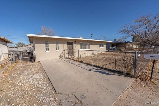 ranch-style home featuring fence private yard