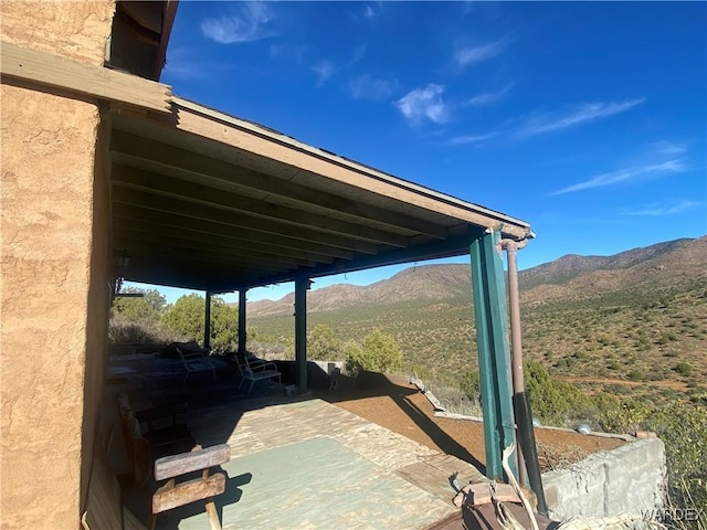 exterior details with a mountain view and stucco siding