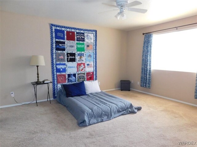 bedroom featuring carpet floors, baseboards, and a ceiling fan