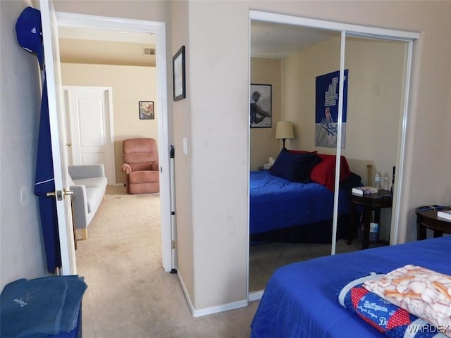 bedroom with carpet, visible vents, and baseboards