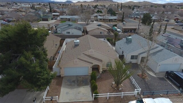 bird's eye view with a residential view and a mountain view