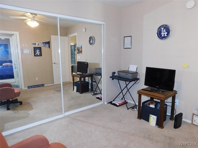 interior space with ceiling fan, carpet flooring, and baseboards