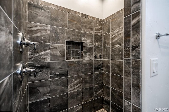 bathroom with tiled shower