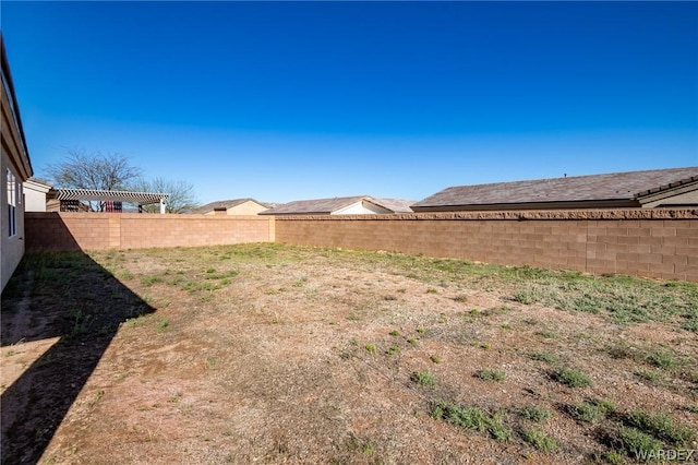 view of yard with a fenced backyard