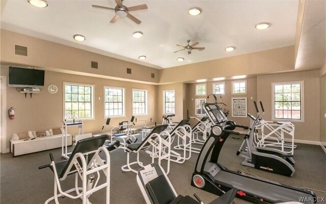 exercise room featuring a ceiling fan, carpet flooring, visible vents, and baseboards