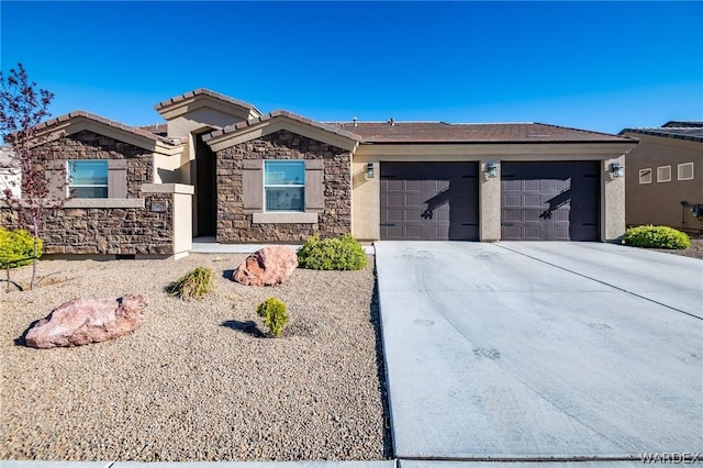 ranch-style home featuring a garage, concrete driveway, stone siding, a tiled roof, and stucco siding