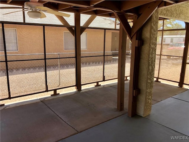 view of patio / terrace with ceiling fan and fence