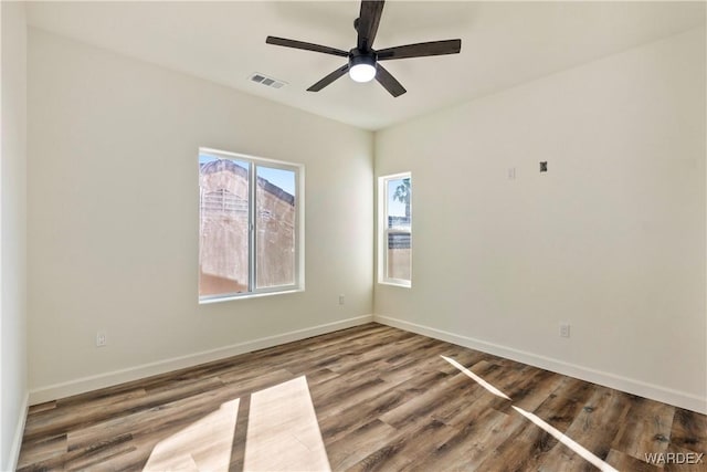 10726 S River Terrace Dr, Mohave Valley, AZ 86440 - unfurnished room with wood finished floors, baseboards, and ceiling fan