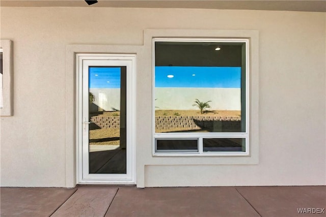10726 S River Terrace Dr, Mohave Valley, AZ 86440 - doorway to property featuring stucco siding