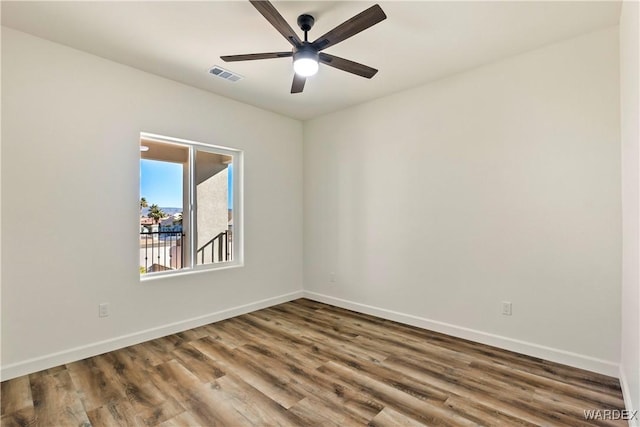 10726 S River Terrace Dr, Mohave Valley, AZ 86440 - spare room featuring wood finished floors, baseboards, and a ceiling fan