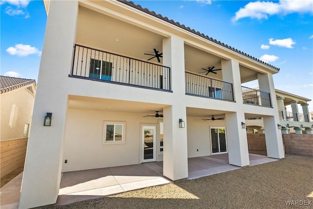 10726 S River Terrace Dr, Mohave Valley, AZ 86440 - back of property featuring ceiling fan, a balcony, stucco siding, fence, and a patio