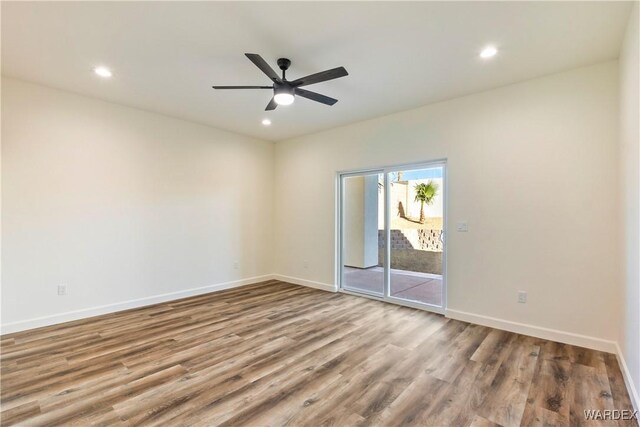 10726 S River Terrace Dr, Mohave Valley, AZ 86440 - unfurnished room with wood finished floors, ceiling fan, recessed lighting, and baseboards