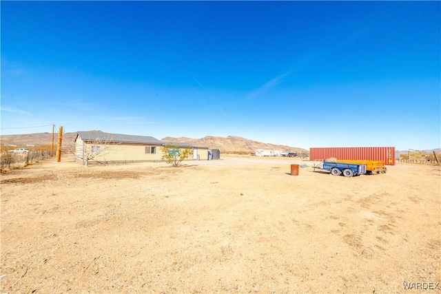 view of yard featuring a mountain view and a rural view